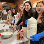 Students laugh and create liquid nitrogen ice cream.